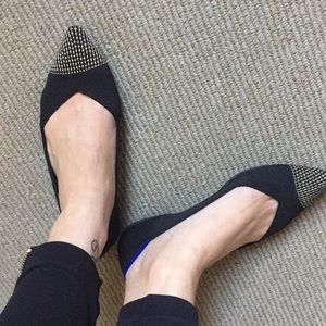 Rothy’s black point with embroidered gold toe